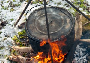 Cooking soup in a winter forest